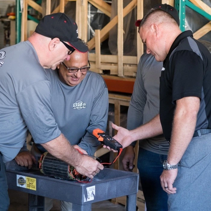 Bo’s Generators technicians working on generator installation